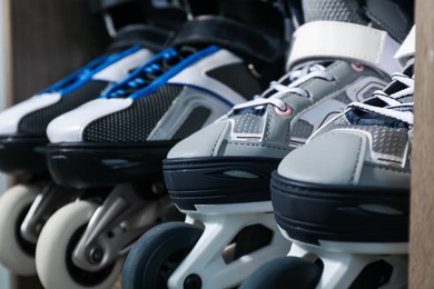 Photo of Pairs of roller skates in shelving unit, closeup