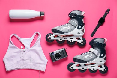 Photo of Flat lay composition with roller skates on pink background