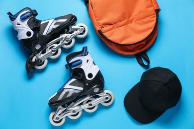 Photo of Flat lay composition with roller skates on blue background