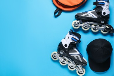 Photo of Flat lay composition with roller skates on blue background. Space for text