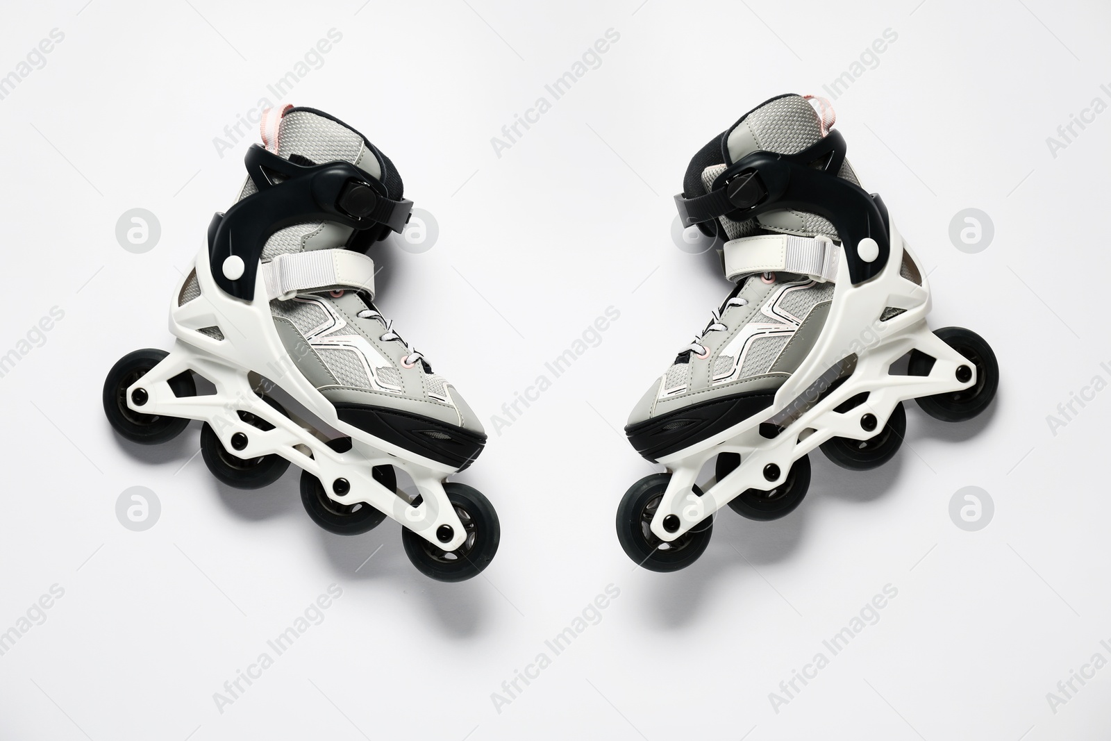 Pair of roller skates on white background, top view Photo of Pair of roller skates on white background, top view