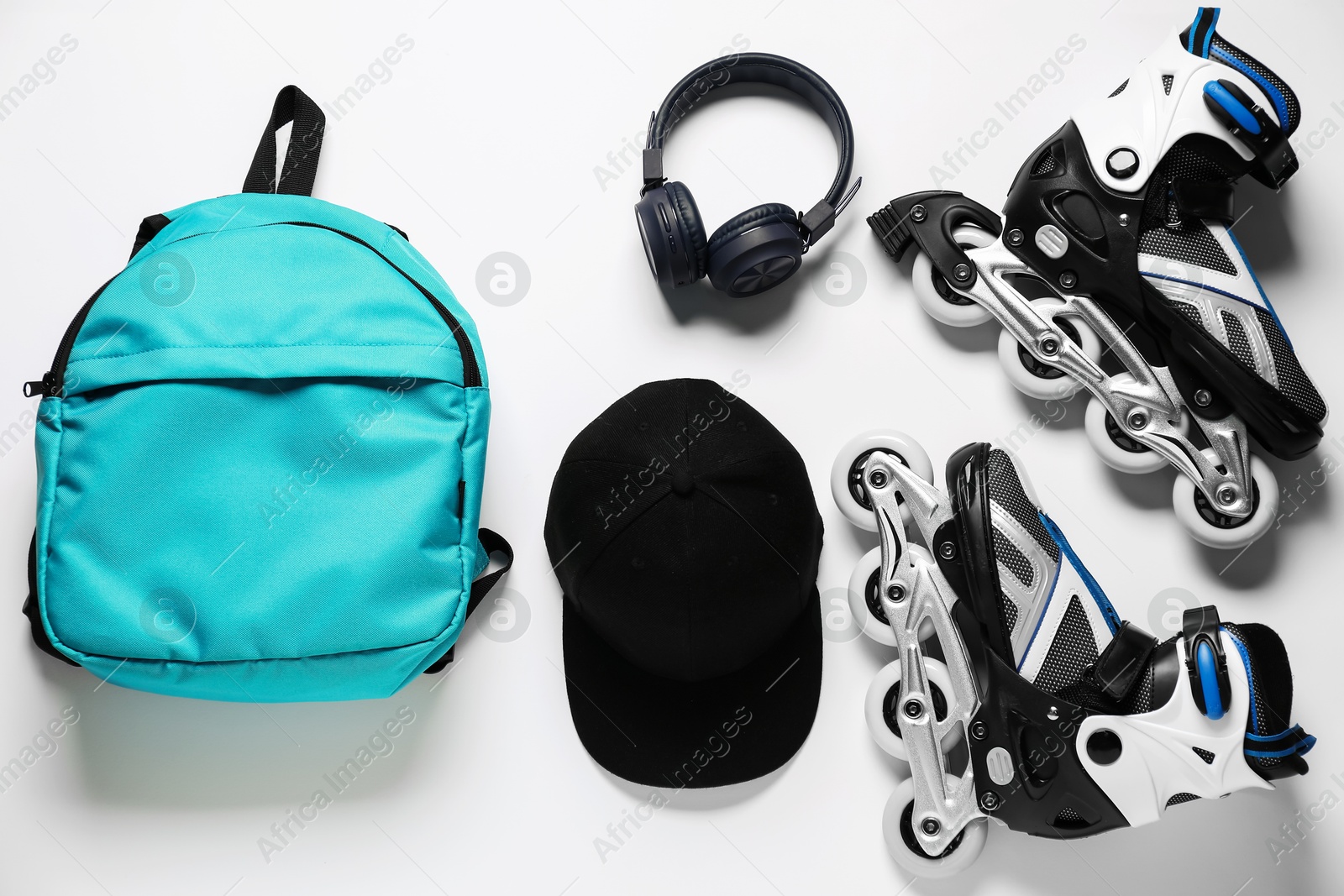 Flat lay composition with roller skates on white background Photo of Flat lay composition with roller skates on white background