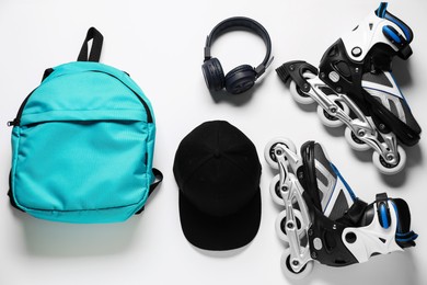 Photo of Flat lay composition with roller skates on white background