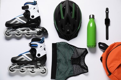 Photo of Flat lay composition with roller skates on white background