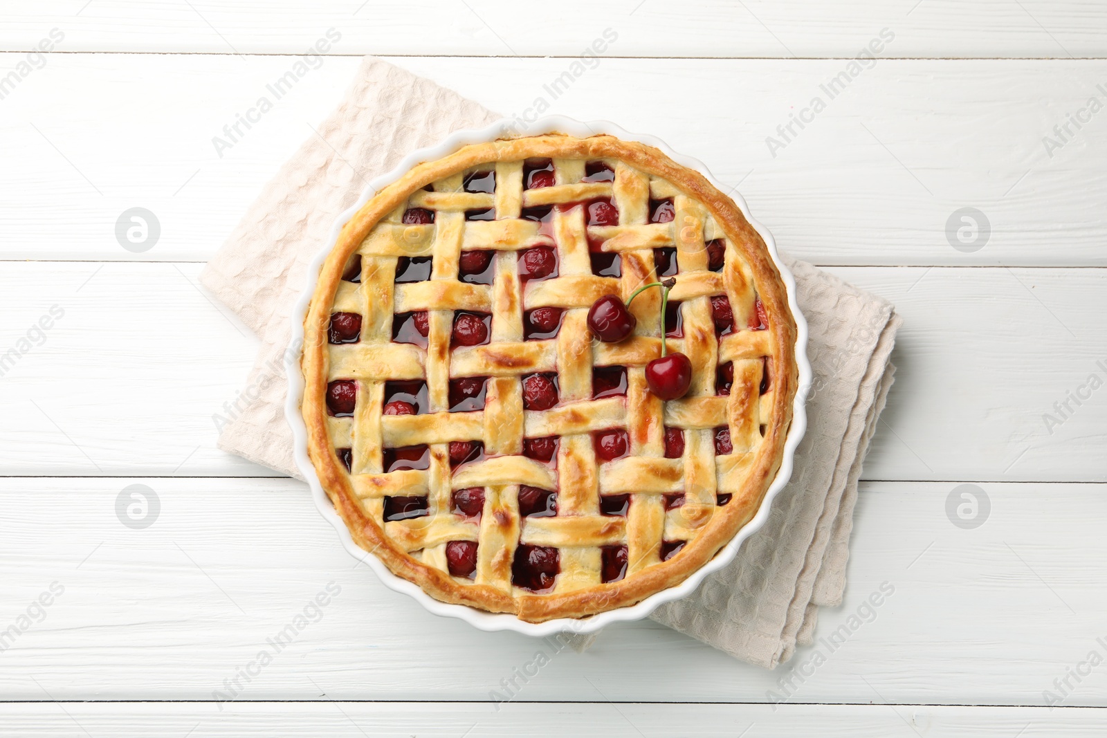 Tasty cherry pie on white wooden table, top view Photo of Tasty cherry pie on white wooden table, top view