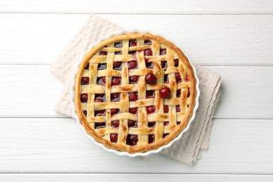 Photo of Tasty cherry pie on white wooden table, top view