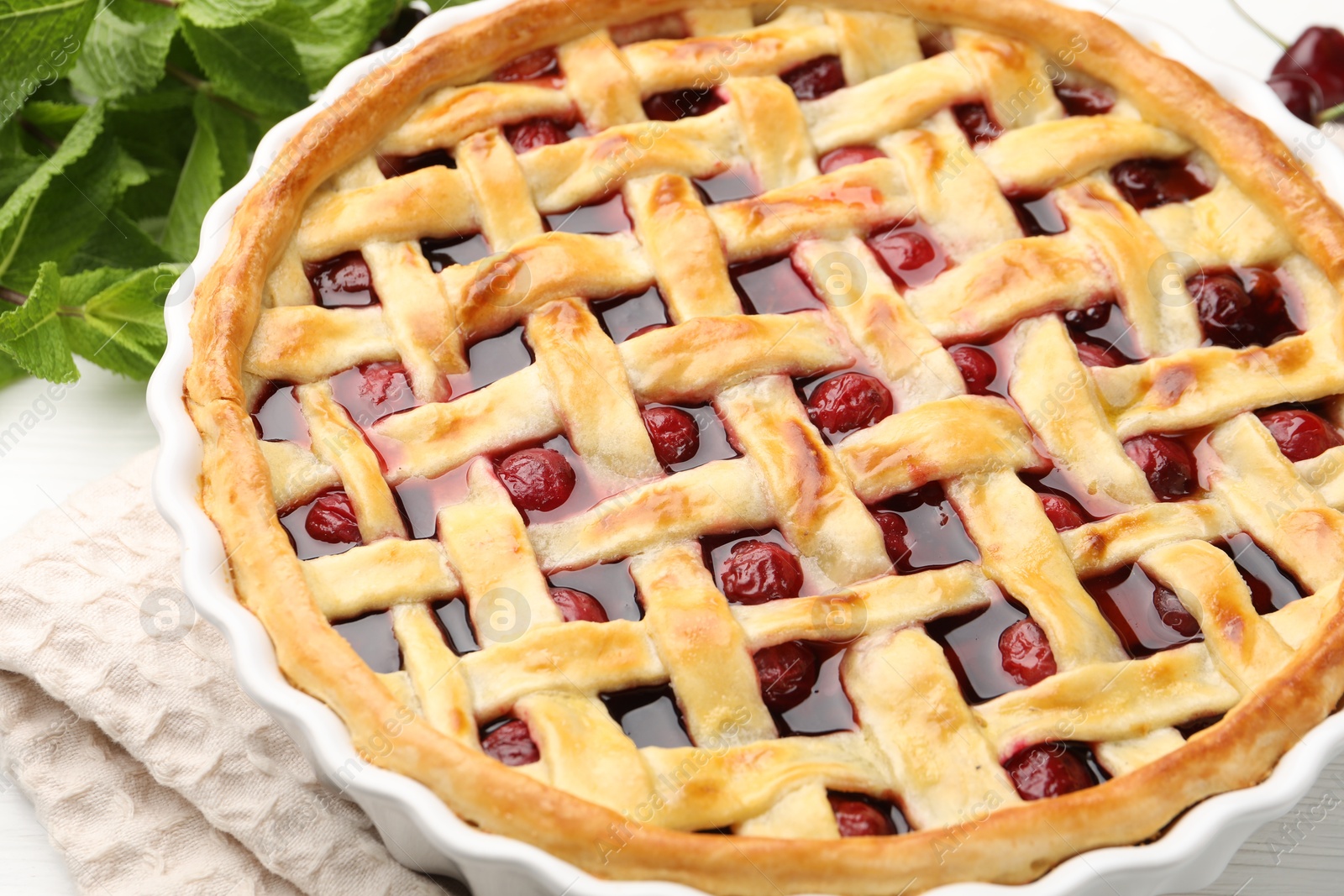 Photo of Tasty cherry pie on table, closeup view