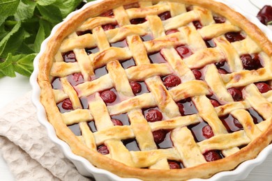 Photo of Tasty cherry pie on table, closeup view
