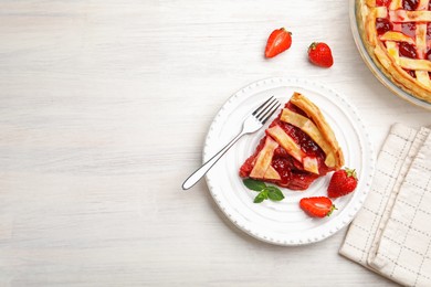 Photo of Piece of tasty strawberry pie and berries on white wooden table, flat lay. Space for text