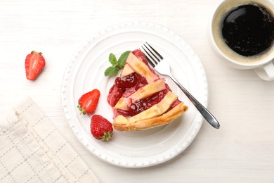 Photo of Piece of tasty strawberry pie and berries on white wooden table, top view