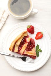 Photo of Piece of tasty strawberry pie and berries on white wooden table, top view
