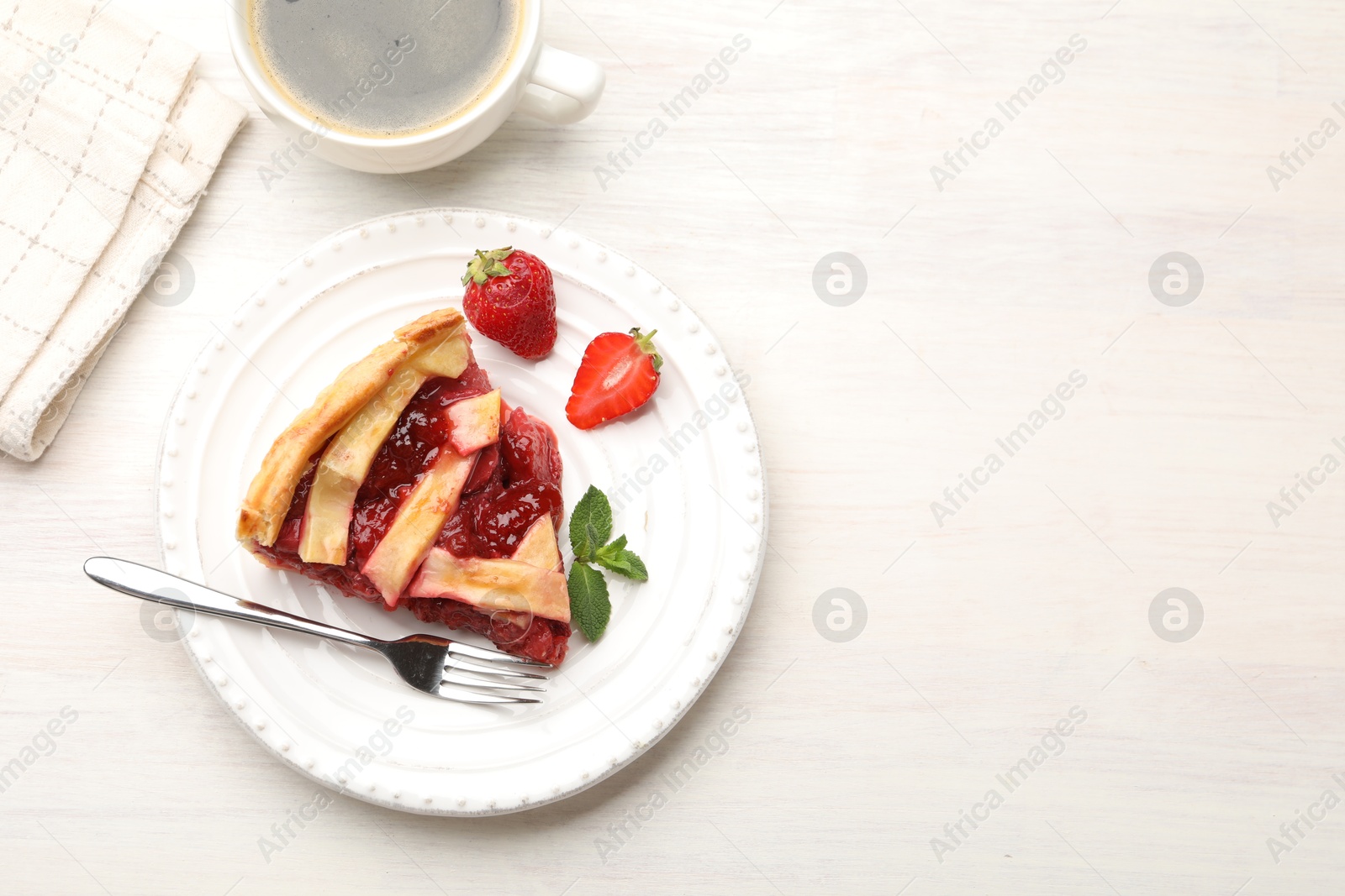 Piece of tasty strawberry pie on white wooden table, top view. Space for text Photo of Piece of tasty strawberry pie on white wooden table, top view. Space for text