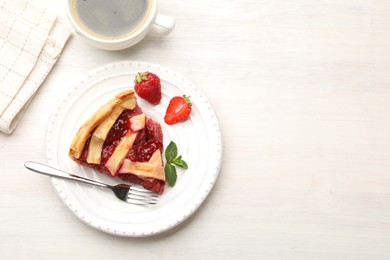 Photo of Piece of tasty strawberry pie on white wooden table, top view. Space for text