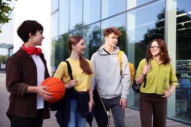 Photo of Group of teenagers spending time together outdoors