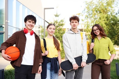 Photo of Group of teenagers spending time together outdoors