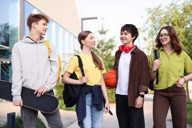 Photo of Group of teenagers spending time together outdoors