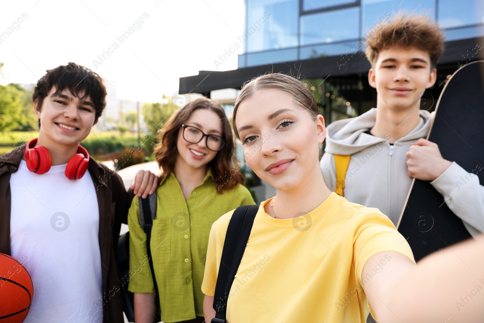 Group of happy teenagers taking selfie outdoors Photo of Group of happy teenagers taking selfie outdoors
