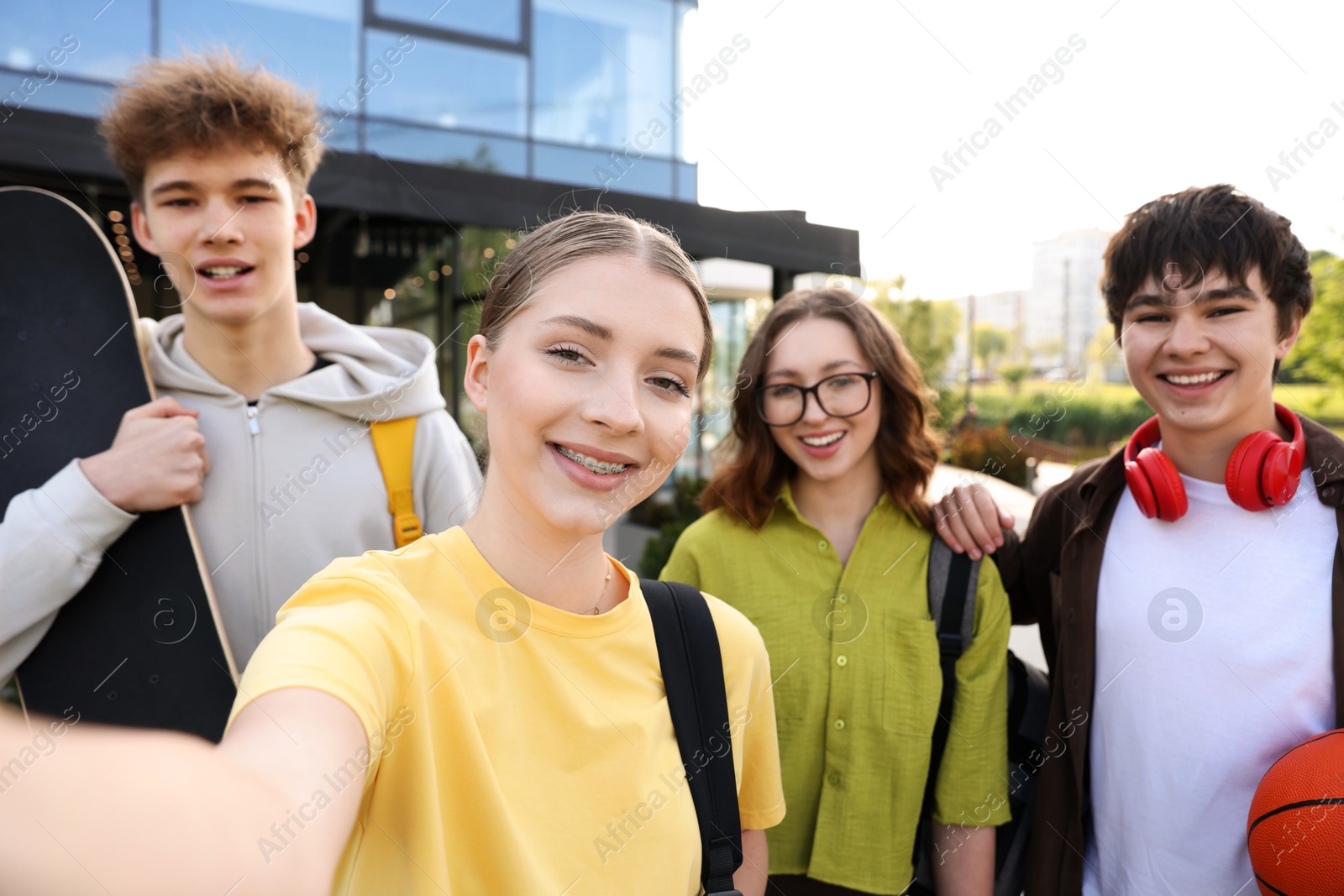 Group of happy teenagers taking selfie outdoors Photo of Group of happy teenagers taking selfie outdoors