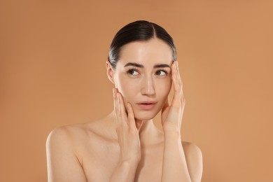 Photo of Beautiful woman after spa treatment on beige background
