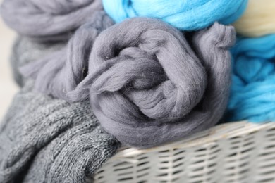 Photo of Soft felting wool in wicker basket, closeup