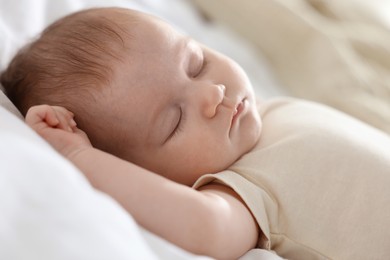 Photo of Cute newborn baby sleeping on bed indoors