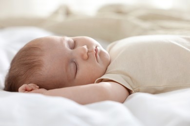 Photo of Cute newborn baby sleeping on bed indoors