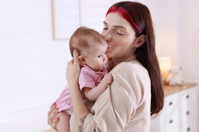 Photo of Mother with her newborn baby at home