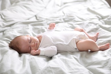 Photo of Cute sweet newborn baby sleeping on bed