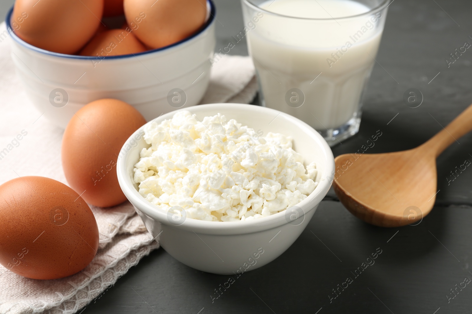 Different dairy products and eggs on grey wooden table, closeup Photo of Different dairy products and eggs on grey wooden table, closeup