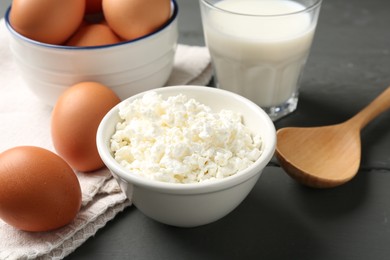 Photo of Different dairy products and eggs on grey wooden table, closeup