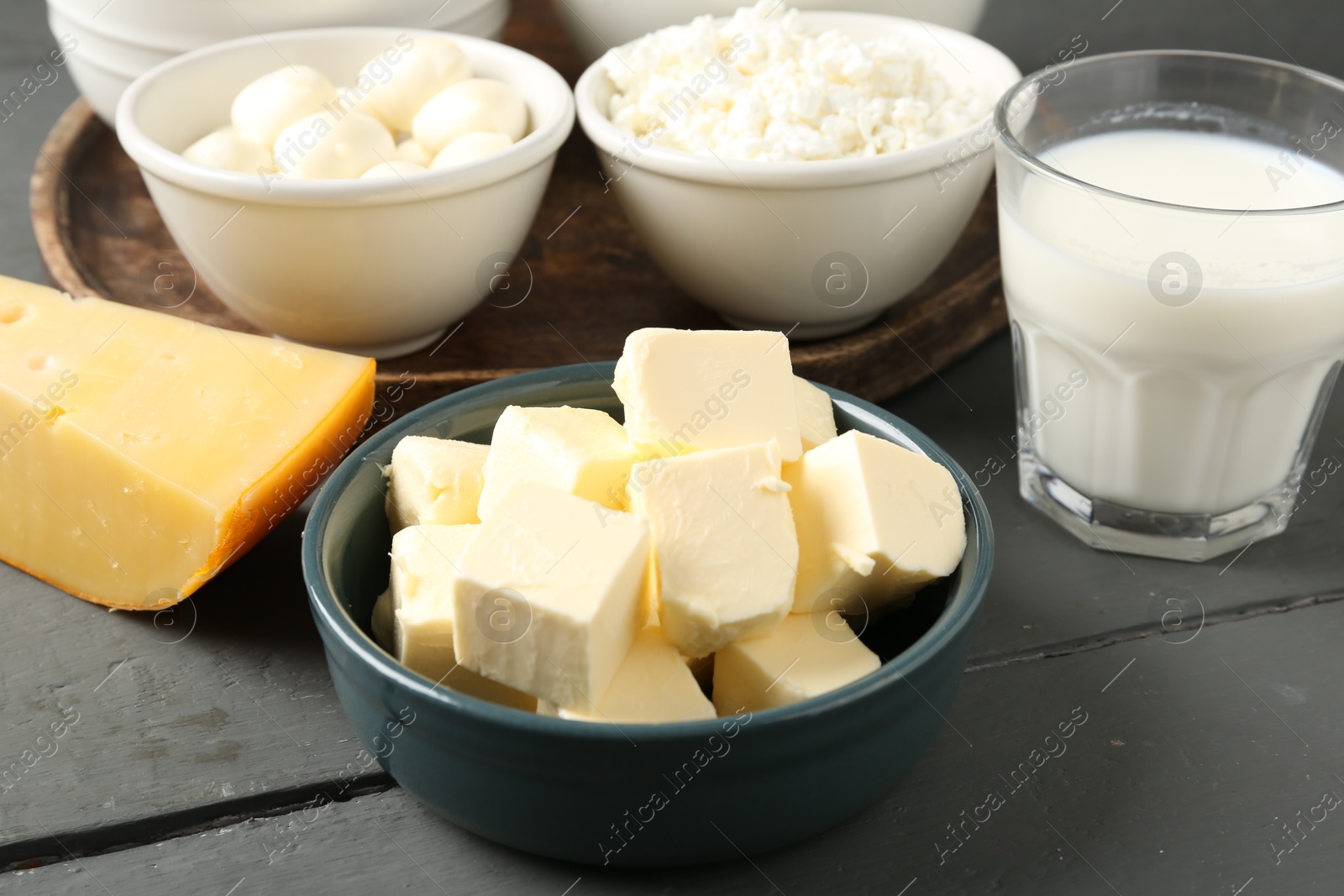 Different dairy products on grey wooden table, closeup Photo of Different dairy products on grey wooden table, closeup