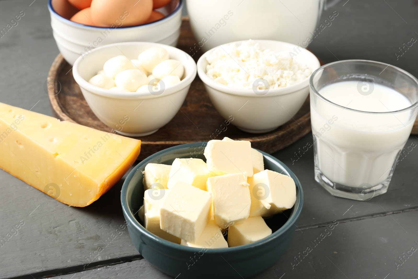 Different dairy products on grey wooden table, closeup Photo of Different dairy products on grey wooden table, closeup