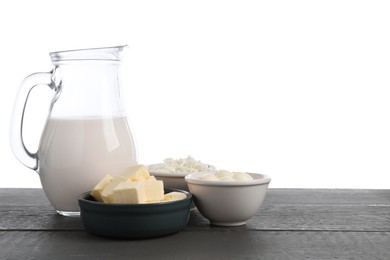 Photo of Different dairy products on grey wooden table against white background