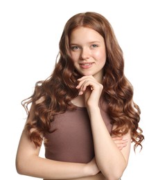 Photo of Portrait of smiling teenage girl with healthy wavy hair on white background