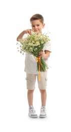 Photo of Cute little boy with bouquet of beautiful chamomile flowers on white background