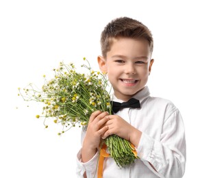 Photo of Smiling little boy with bouquet of beautiful chamomile flowers on white background