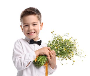 Photo of Smiling little boy with bouquet of beautiful chamomile flowers on white background