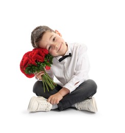 Photo of Cute little boy with bouquet of beautiful flowers on white background