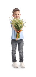 Photo of Cute little boy giving bouquet of beautiful chamomile flowers on white background