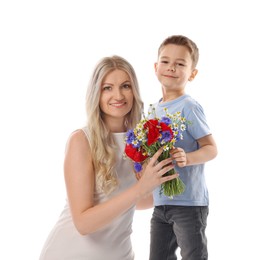 Photo of Little boy presenting bouquet of beautiful flowers to his smiling mother on white background