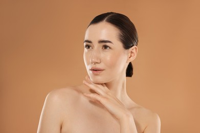 Photo of Beautiful woman after spa treatment on beige background
