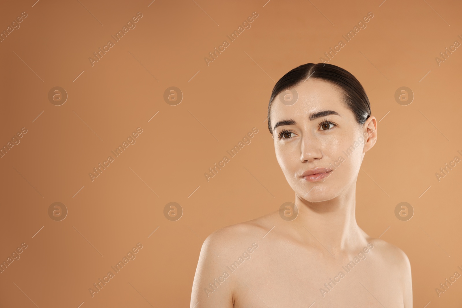 Beautiful woman after spa treatment on beige background. Space for text Photo of Beautiful woman after spa treatment on beige background. Space for text