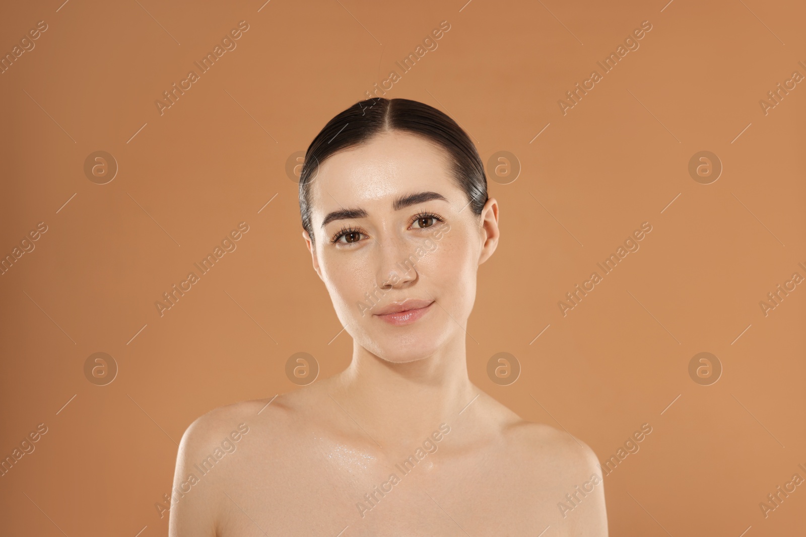 Beautiful woman after spa treatment on beige background Photo of Beautiful woman after spa treatment on beige background