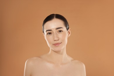 Photo of Beautiful woman after spa treatment on beige background