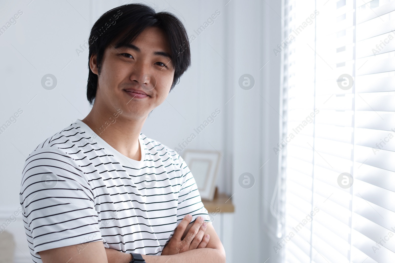 Portrait of handsome man at home. Space for text Photo of Portrait of handsome man at home. Space for text