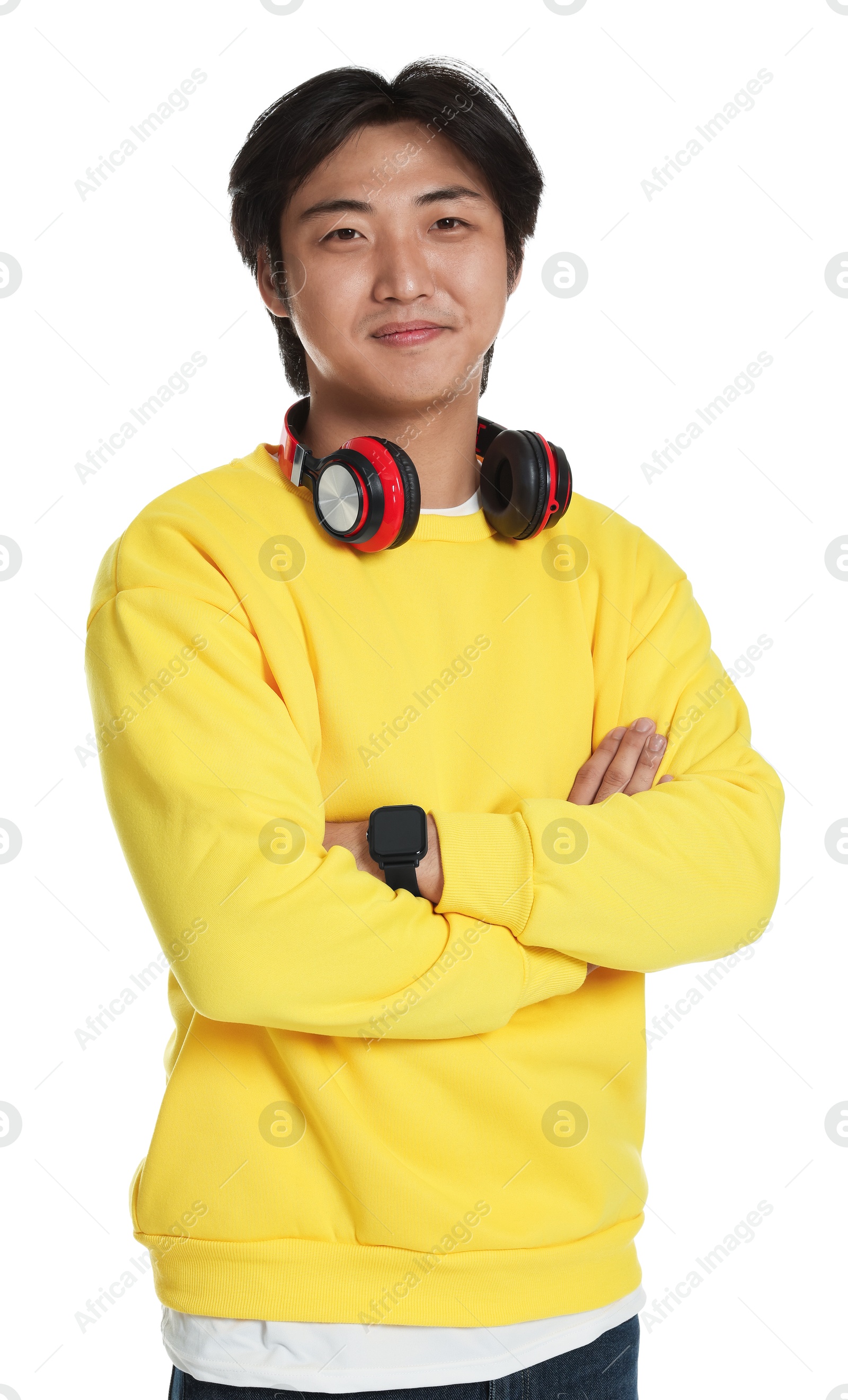 Portrait of handsome Asian man with headphones on white background Photo of Portrait of handsome Asian man with headphones on white background