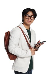 Photo of Portrait of handsome Asian man in glasses with smartphone and backpack on white background