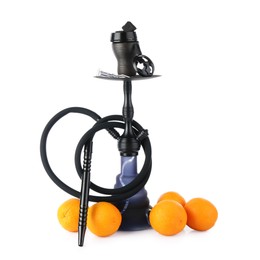 Photo of Dark traditional hookah and oranges isolated on white