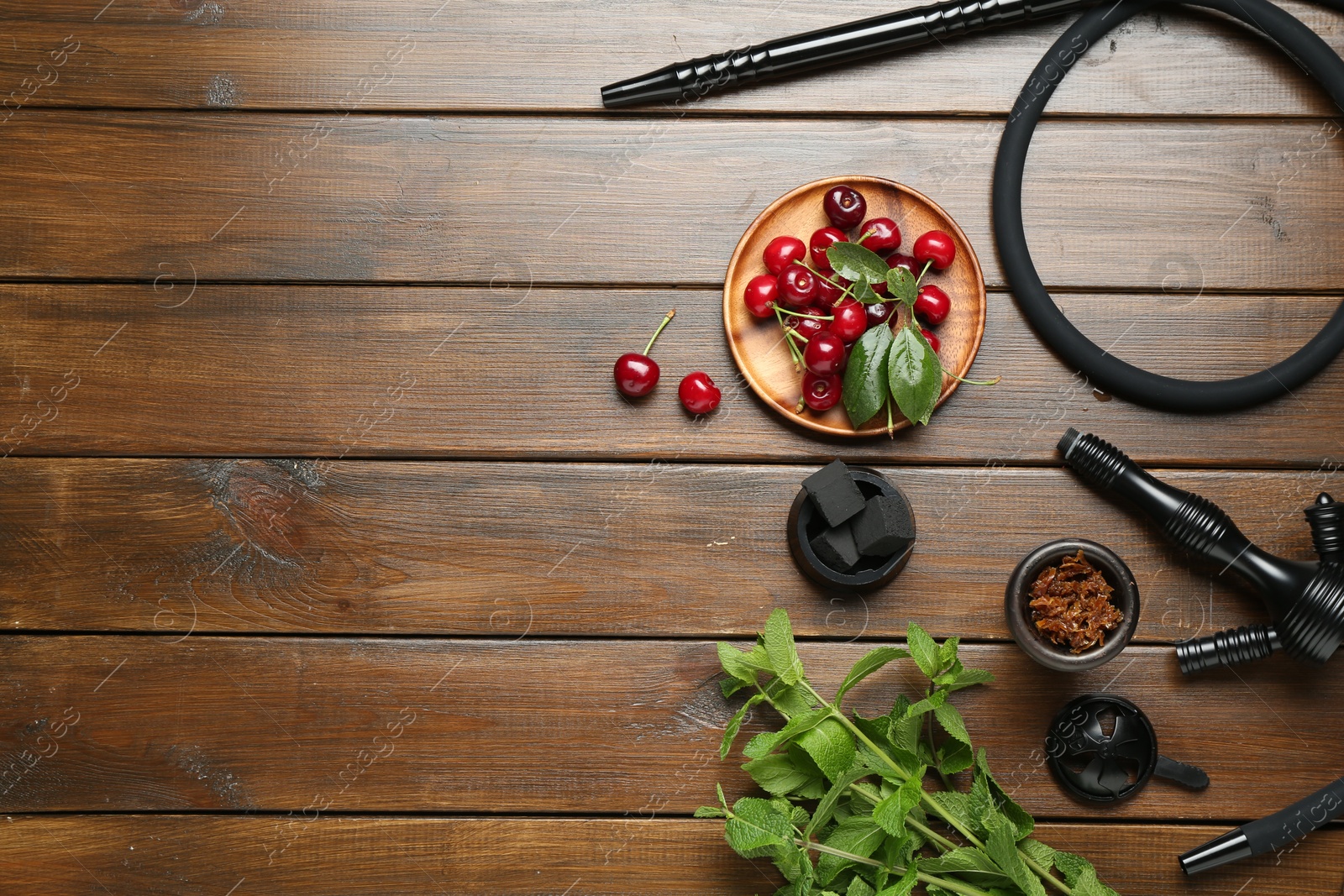 Photo of Flat lay composition with traditional hookah parts on wooden table, space for text