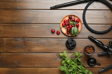 Photo of Flat lay composition with traditional hookah parts on wooden table, space for text
